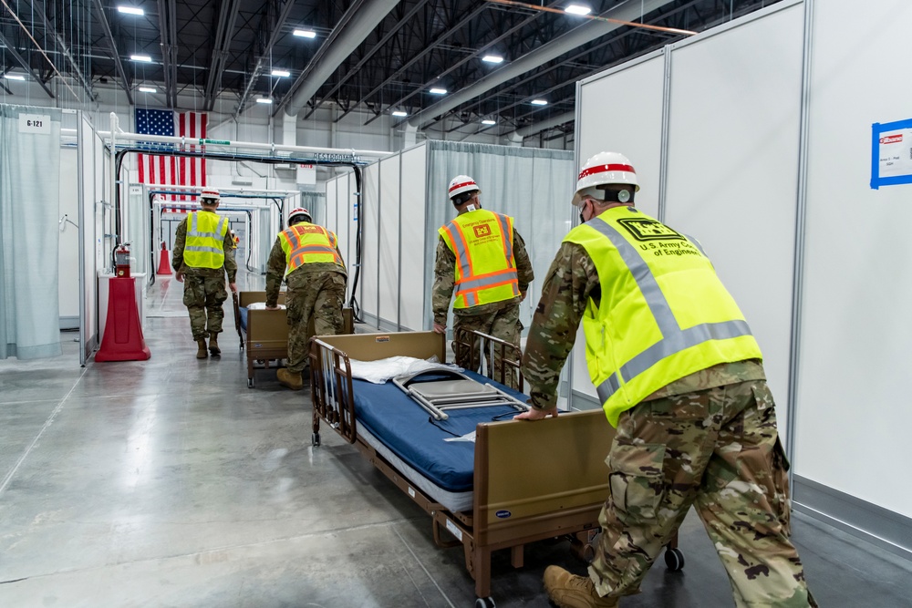 Michigan National Guard members place beds at COVID-19 alternate care facility