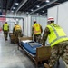 Michigan National Guard members place beds at COVID-19 alternate care facility