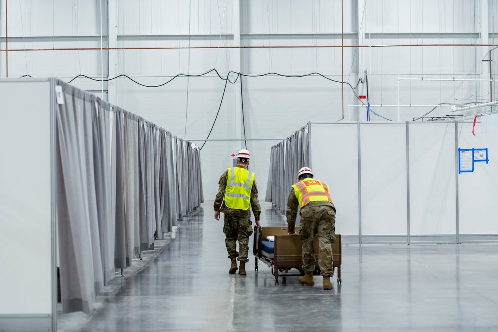 Michigan National Guard members place beds at COVID-19 alternate care facility