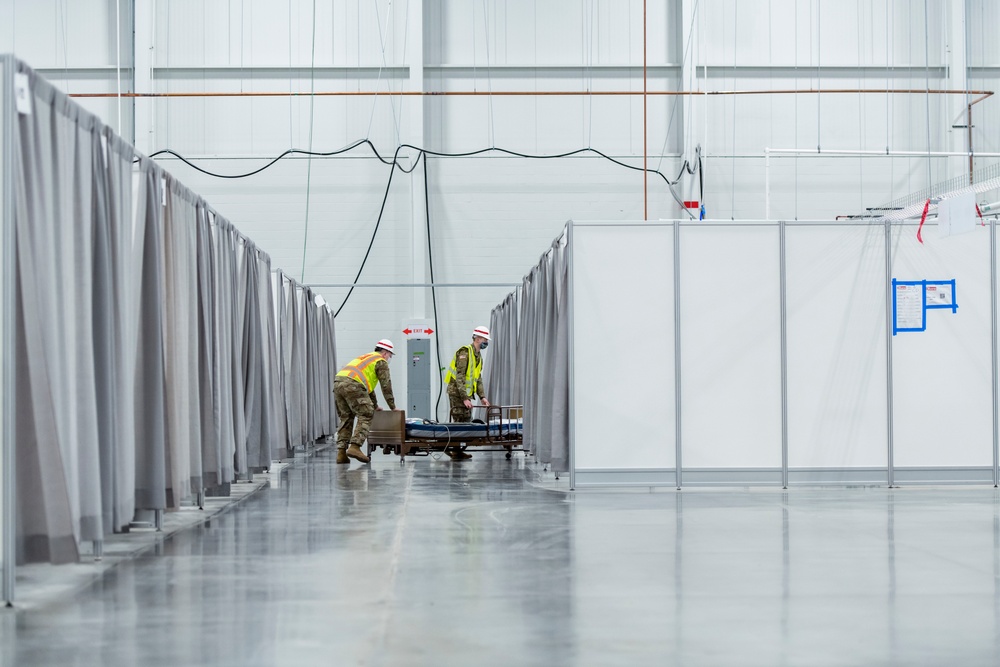 Michigan National Guard members place beds at COVID-19 alternate care facility