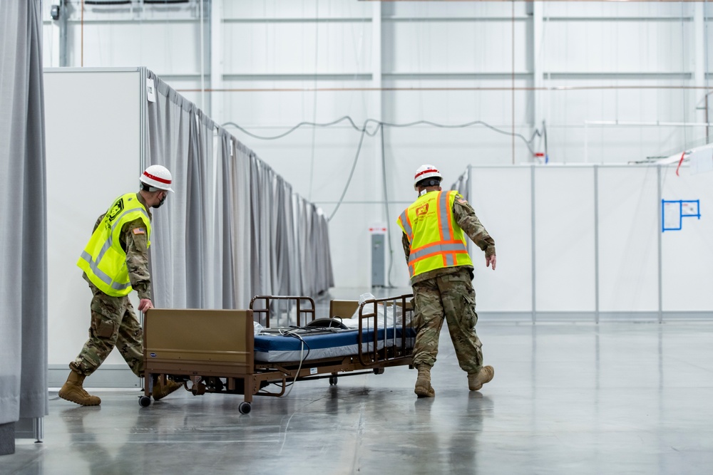 Michigan National Guard members place beds at COVID-19 alternate care facility