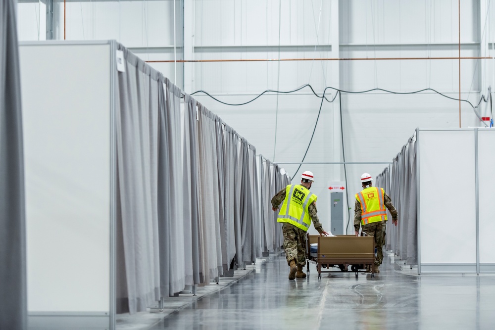 Michigan National Guard members place beds at COVID-19 alternate care facility