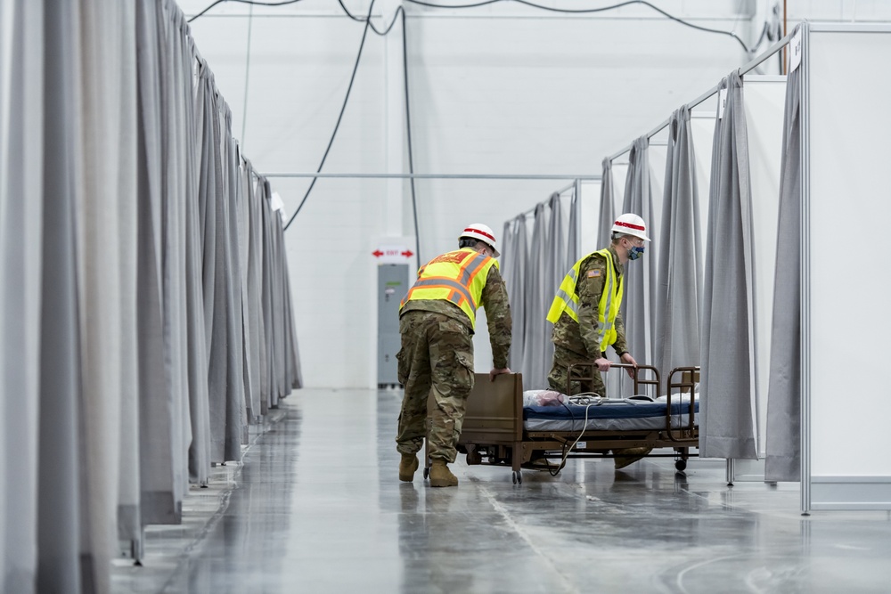 Michigan National Guard members place beds at COVID-19 alternate care facility