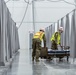 Michigan National Guard members place beds at COVID-19 alternate care facility