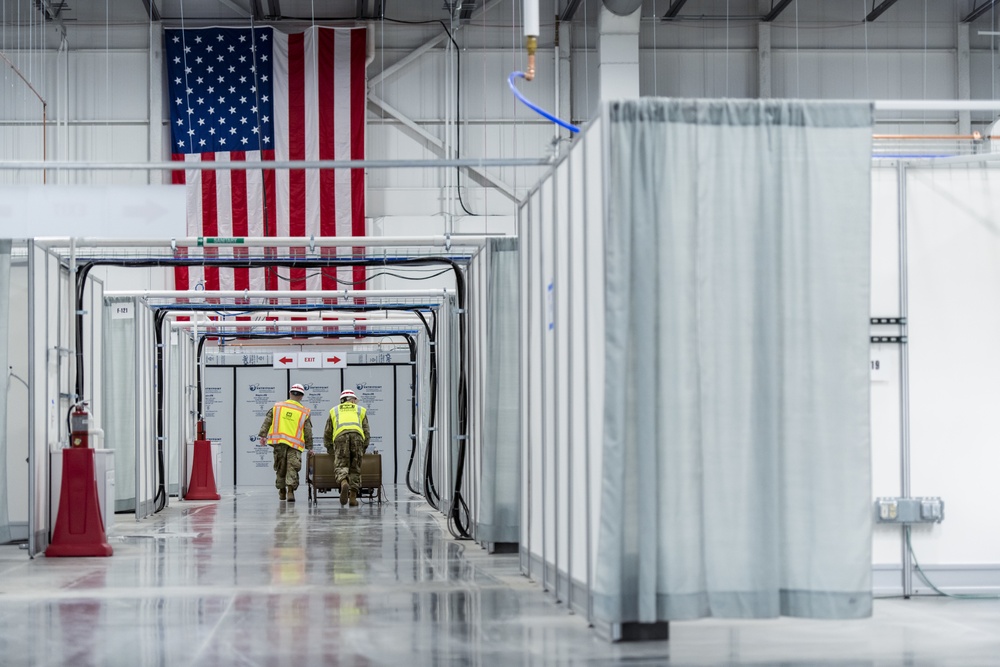 Michigan National Guard members place beds at COVID-19 alternate care facility