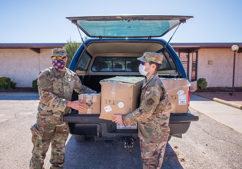 Senior Airman Quintana and Staff Sergeant Martinez deliver personal protective equipment to Grants, New Mexico.