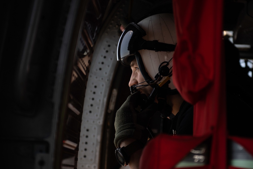 U.S. Sailor observes flight operations