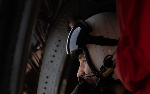 U.S. Sailor observes flight operations