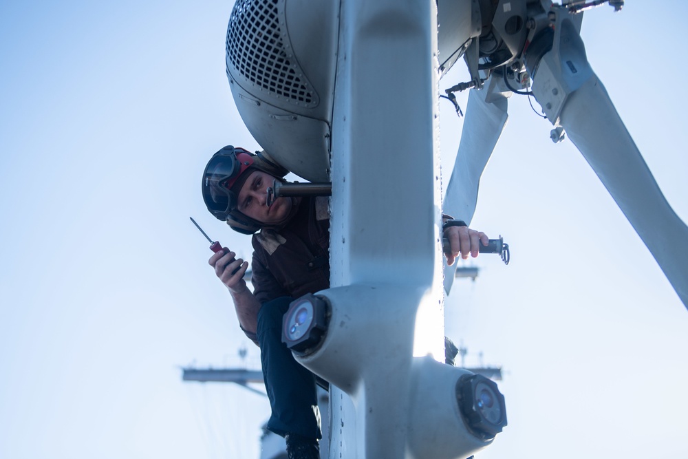 U.S. performs maintenance on an MH-60S Sea Hawk