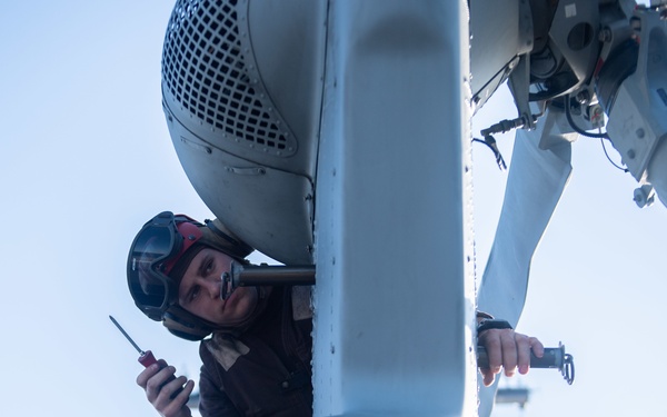 U.S. performs maintenance on an MH-60S Sea Hawk