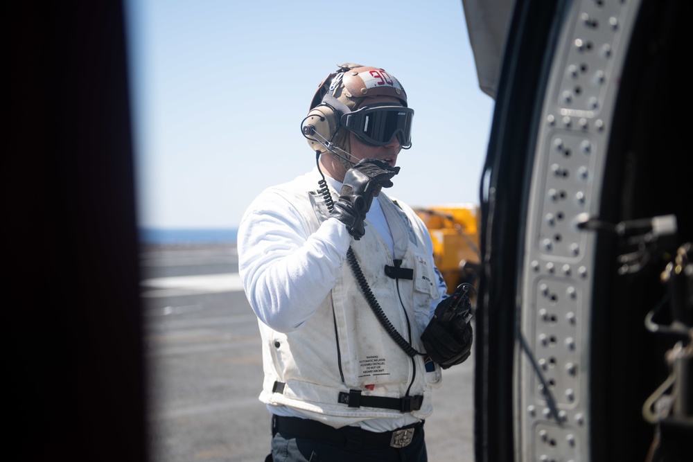 U.S. Sailor pre-flights MH-60S Sea Hawk