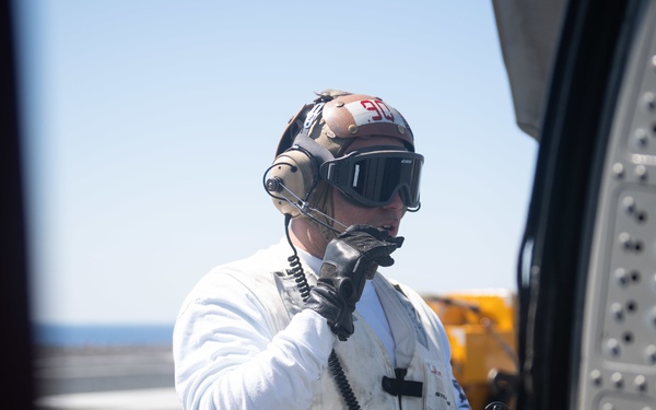 U.S. Sailor pre-flights MH-60S Sea Hawk