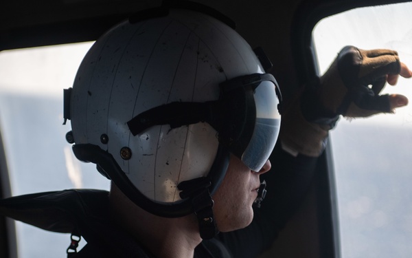 U.S. Sailor observes flight operations