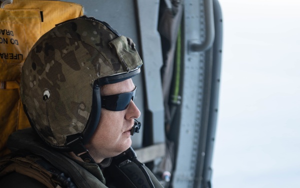 U.S. Sailor observes flight operations
