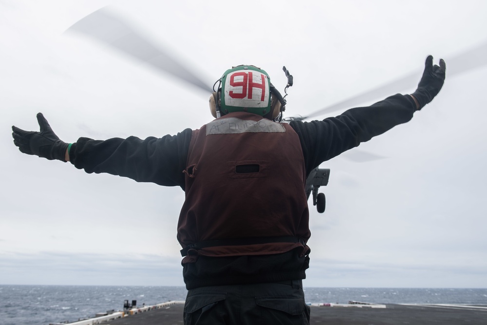 U.S. Sailor launches MH-60S Sea Hawk