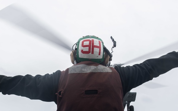 U.S. Sailor launches MH-60S Sea Hawk