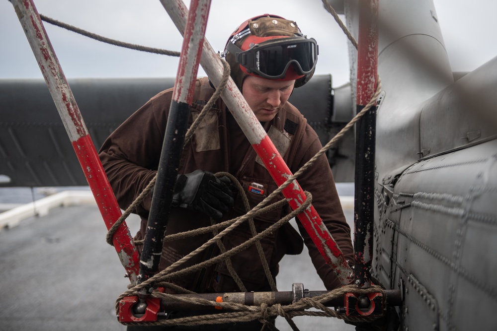 U.S. Sailor pre-flights MH-60S Sea Hawk