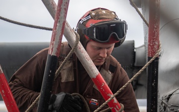 U.S. Sailor pre-flights MH-60S Sea Hawk