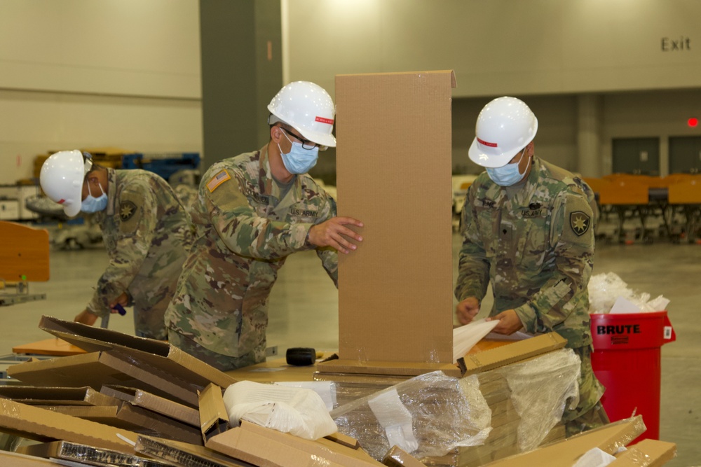 Florida National Guard Soldiers assemble hospital beds for alternate care facilities