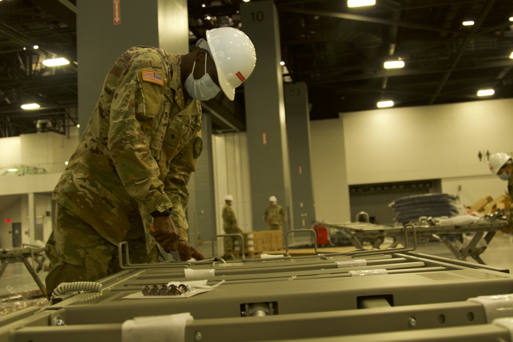 Florida National Guard Soldiers assemble hospital beds for alternate care facilities