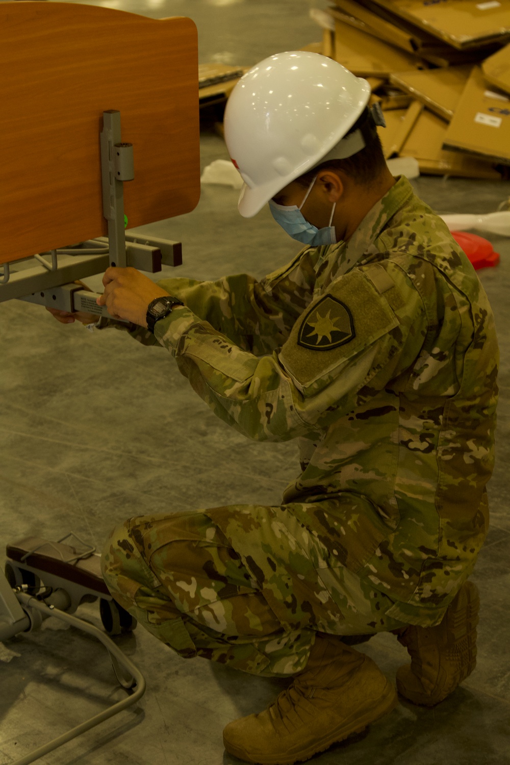 Florida National Guard Soldiers assemble hospital beds for alternate care facilities