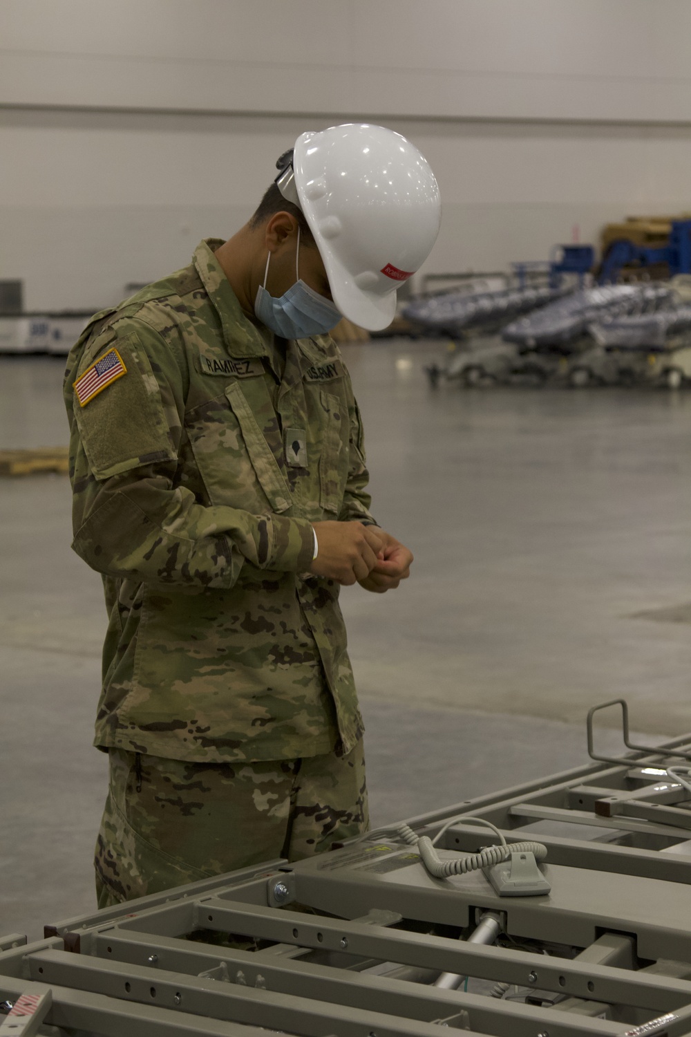 Florida National Guard Soldiers assemble hospital beds for alternate care facilities