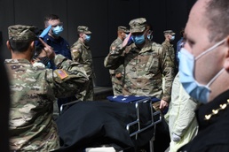 Military personnel honor deceased veteran in New York City