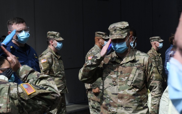 Military members honor veteran who died from COVID-19 at NYC field hospital