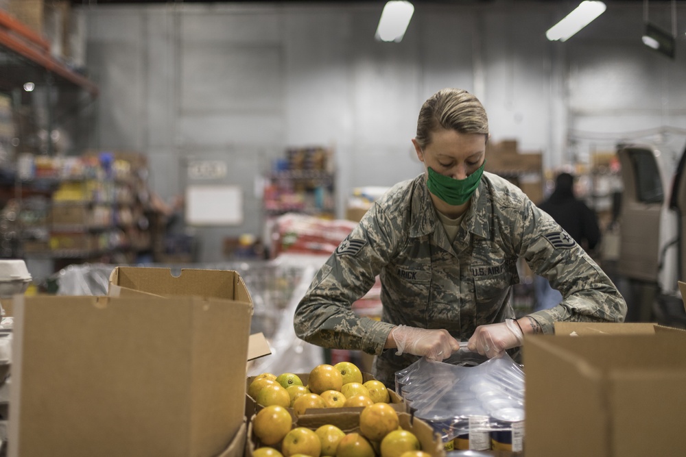 Staff Sgt. Celia Arick helps serve at the South Michigan Food Bank in Battle Creek