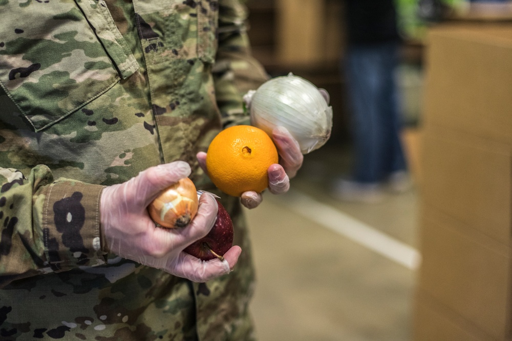 110th Wing packages food at the South Michigan Food Bank during COVID-19 response