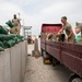 Soldiers unload and stack sandbags at Erbil Air Base