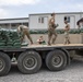 Soldiers unload and stack sandbags at Erbil Air Base