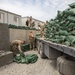 Soldiers unload and stack sandbags at Erbil Air Base