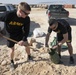 Soldiers fill sandbags and increase force protection measures