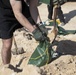 Soldiers fill sandbags and increase force protection measures