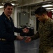 31st MEU Marine awarded by Rear Adm. Kacher aboard USS America