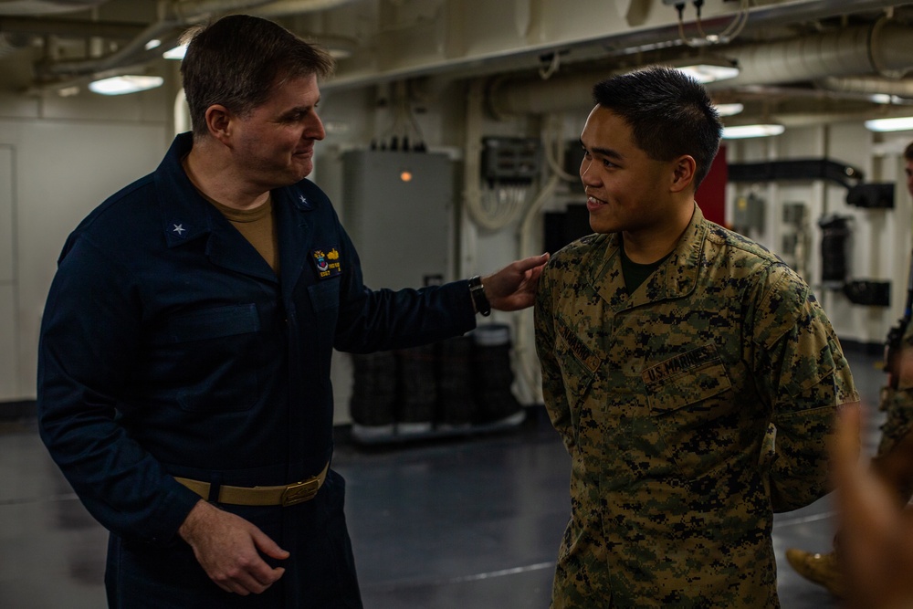 31st MEU Marine awarded by Rear Adm. Kacher aboard USS America