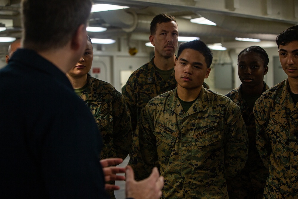 31st MEU Marine awarded by Rear Adm. Kacher aboard USS America