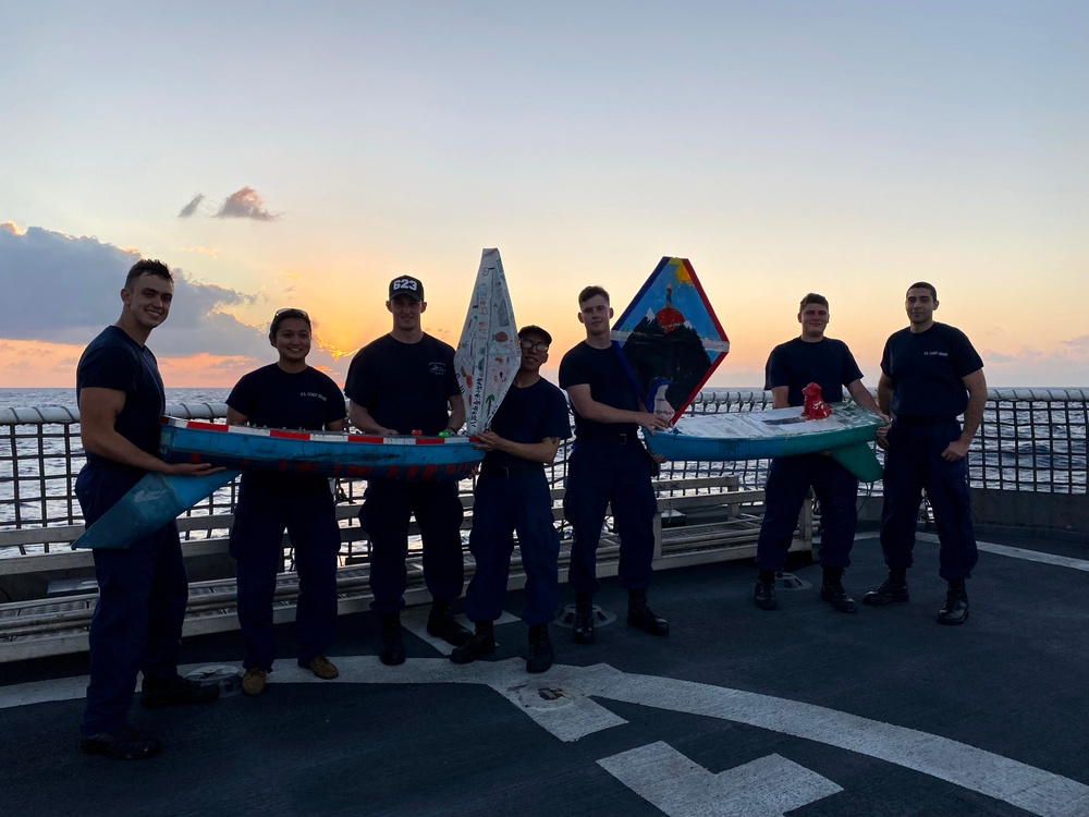 Coast Guard Cutter Steadfast crewmembers participate in the Columbia River Maritime Museum’s Mini Boat Project while underway in the Eastern Pacific  Ocean