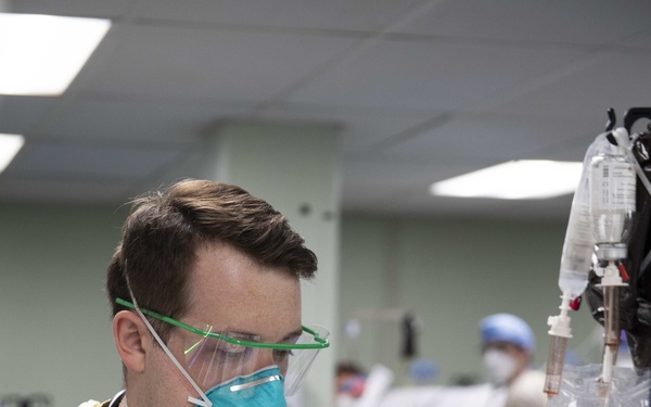 U.S. Navy Doctors, Nurses and Corpsmen Treat COVID Patients in the ICU Aboard USNS Comfort