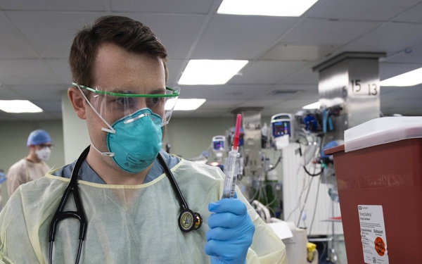U.S. Navy Doctors, Nurses and Corpsmen Treat COVID Patients in the ICU Aboard USNS Comfort