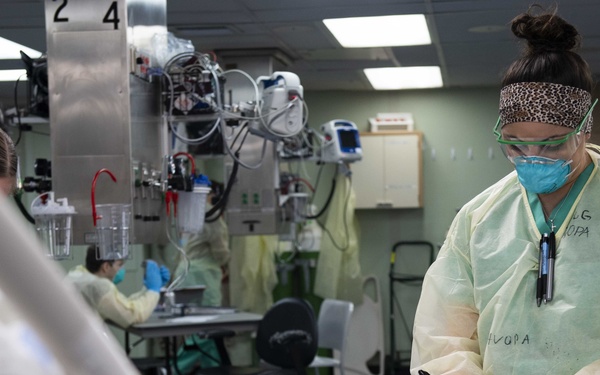 U.S. Navy Doctors, Nurses and Corpsmen Treat COVID Patients in the ICU Aboard USNS Comfort