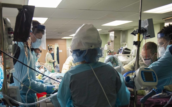 U.S. Navy Doctors, Nurses and Corpsmen Treat COVID Patients in the ICU Aboard USNS Comfort
