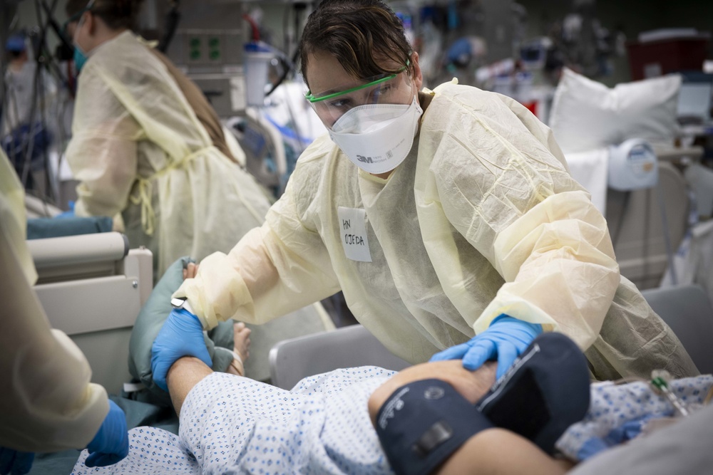 U.S. Navy Doctors, Nurses and Corpsmen Treat COVID Patients in the ICU Aboard USNS Comfort