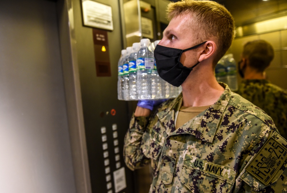 Sailors and Marines Support USS Theodore Roosevelt Personnel in Quarantine