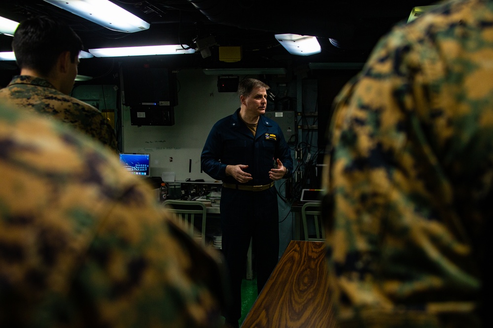 31st MEU Marine honored by Rear Adm. Kacher aboard USS America