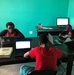 Monroe children do schoolwork