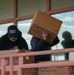 Marines, fire fighters &amp; families volunteer to move NMCRS Thrift Store