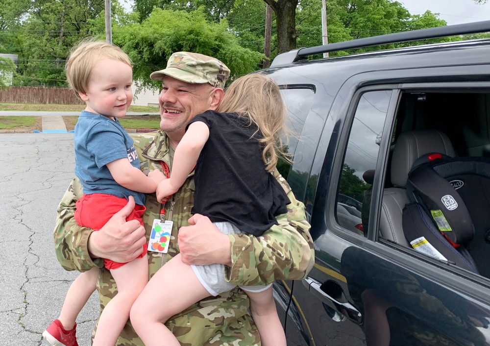 Maj. Russell Tart takes a lunchbreak moment to connect with his grandchildren
