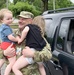 Maj. Russell Tart takes a lunchbreak moment to connect with his grandchildren